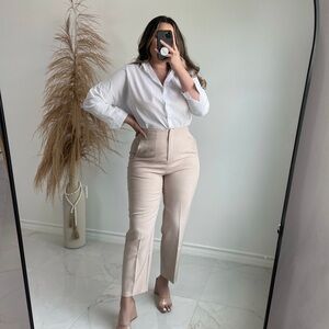Beige pleated trousers